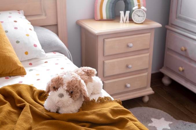 cama nido con peluche encima
